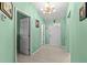 Tiled entryway featuring a light fixture and multiple doorways at 1489 Ridge Shore Dr, Tarpon Springs, FL 34689