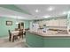 Bright kitchen with appliances and a dining area at 1489 Ridge Shore Dr, Tarpon Springs, FL 34689