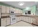 Spacious kitchen with granite countertops and tile backsplash at 1489 Ridge Shore Dr, Tarpon Springs, FL 34689