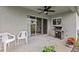 Covered patio area featuring a grill and seating at 1489 Ridge Shore Dr, Tarpon Springs, FL 34689