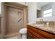 Bathroom features a tiled walk-in shower and granite vanity at 1503 Council Dr, Sun City Center, FL 33573