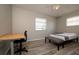 Bedroom featuring wood-look flooring, a ceiling fan, and a window at 1503 Council Dr, Sun City Center, FL 33573