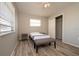 Bedroom features wood-look flooring and a closet for storage at 1503 Council Dr, Sun City Center, FL 33573