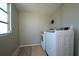 Laundry Room featuring a washer and a dryer at 1503 Council Dr, Sun City Center, FL 33573