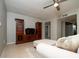 Cozy living room featuring stylish furniture, a ceiling fan, and wood-look cabinets at 1503 Council Dr, Sun City Center, FL 33573