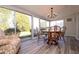 Sunroom boasts many windows and natural lighting at 1503 Council Dr, Sun City Center, FL 33573