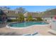 Community pool offers a relaxing retreat with lounge chairs and well-kept brick pavers at 1719 Belleair Forest Dr # B, Belleair, FL 33756