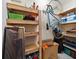 Basement storage area with shelving, and a bicycle hanging on the wall at 1719 Belleair Forest Dr # B, Belleair, FL 33756