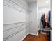 Organized walk-in closet with ample shelving and storage space at 1719 Belleair Forest Dr # B, Belleair, FL 33756