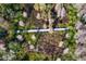 Scenic aerial shot of a boardwalk path winding through a lush green forest and wetland area at 18312 Pleasant Ridge Pl, Lutz, FL 33548