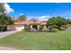 Picture-perfect single-Gathering home with lush green lawn and manicured landscaping at 18312 Pleasant Ridge Pl, Lutz, FL 33548