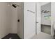 Modern bathroom with black fixtures, tile shower, and access to bedroom at 1910 W North A St # 5, Tampa, FL 33606