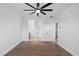 Spacious bedroom with wood floors, a ceiling fan, and access to an ensuite bathroom at 1910 W North A St # 5, Tampa, FL 33606