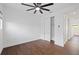 Bedroom with wood floors, ceiling fan, closet, and white trim at 1910 W North A St # 5, Tampa, FL 33606