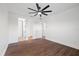 Clean bedroom featuring wood floors, a ceiling fan, and two closets at 1910 W North A St # 5, Tampa, FL 33606