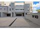 Contemporary condo exterior featuring private garages, modern architecture, and brick-paved walkways at 1910 W North A St # 5, Tampa, FL 33606