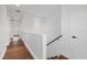Bright hallway featuring wood floors and stairs leading to the home's upper level at 1910 W North A St # 5, Tampa, FL 33606
