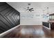 Spacious living room with hardwood floors and an accent wall at 1910 W North A St # 5, Tampa, FL 33606