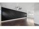 Large living room with hardwood floors and accent wall at 1910 W North A St # 5, Tampa, FL 33606