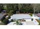 Well-maintained home with new roof, pristine landscaping, and desirable waterfront access with a boat dock at 201 79Th Ne Ave, St Petersburg, FL 33702