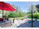 The backyard features an outdoor dining area and a firepit, ideal for entertaining and relaxing at 201 79Th Ne Ave, St Petersburg, FL 33702