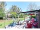 Backyard with patio, dining set, boat lift and lush landscaping offer a serene outdoor retreat at 201 79Th Ne Ave, St Petersburg, FL 33702