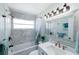 Bathroom featuring an elegant marble shower and modern fixtures for a luxurious feel at 201 79Th Ne Ave, St Petersburg, FL 33702
