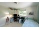 Single bed bedroom with integrated workspace, decorated with coastal themes at 201 79Th Ne Ave, St Petersburg, FL 33702
