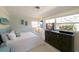 Bright bedroom with a large window and a stylish, beach-themed decor at 201 79Th Ne Ave, St Petersburg, FL 33702
