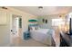 Bedroom featuring coastal decor with a painted headboard and coordinated accent pieces at 201 79Th Ne Ave, St Petersburg, FL 33702