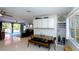 Cozy dining area features a unique wood table, seamlessly connecting to the living space at 201 79Th Ne Ave, St Petersburg, FL 33702
