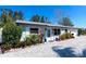 Charming single-story home with a well-maintained front yard and landscaping at 201 79Th Ne Ave, St Petersburg, FL 33702