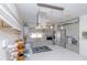Modern gray kitchen with stainless steel appliances, island with range, and stylish finishes at 201 79Th Ne Ave, St Petersburg, FL 33702
