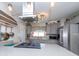 View of kitchen with stainless steel appliances, range and eat-in bar, with modern pendant lighting at 201 79Th Ne Ave, St Petersburg, FL 33702