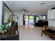 Bright and open living room with barrel-style accents, offering a unique and inviting space at 201 79Th Ne Ave, St Petersburg, FL 33702
