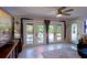 Bright living room with doors to patio and a view of the landscaped backyard at 201 79Th Ne Ave, St Petersburg, FL 33702