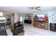 Spacious living room with an open floor plan, seamlessly connecting the kitchen, dining, and lounge areas at 201 79Th Ne Ave, St Petersburg, FL 33702
