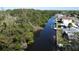 Scenic waterfront view showing the canal, lush trees, docks, and neighborhood homes at 201 79Th Ne Ave, St Petersburg, FL 33702