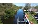 View of the waterfront canal and boat lift, providing convenient access to waterways and picturesque scenery at 201 79Th Ne Ave, St Petersburg, FL 33702