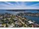 Residential neighborhood features mature trees, waterway access, and several houses with private boat docks at 2340 W Bay Isle Se Dr, St Petersburg, FL 33705