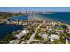 Stunning aerial view of the property with a circular view highlighting its waterfront location and nearby city skyline at 2340 W Bay Isle Se Dr, St Petersburg, FL 33705