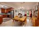 Inviting dining area with a glass table and seating for six, adjacent to the modern kitchen at 2340 W Bay Isle Se Dr, St Petersburg, FL 33705