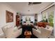 Bright living room featuring stylish furnishings, a ceiling fan, and a cozy atmosphere with a modern flair at 2340 W Bay Isle Se Dr, St Petersburg, FL 33705