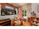 Bright living room with pink door, tropical themed chair, and views of the outdoors at 2340 W Bay Isle Se Dr, St Petersburg, FL 33705
