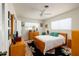 Serene bedroom with a ceiling fan, a large bed, and ample closet space at 2340 W Bay Isle Se Dr, St Petersburg, FL 33705