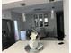 Dining room with a glass table, modern light fixtures, and view of the kitchen at 2710 W Osborne Ave # 1, Tampa, FL 33614