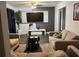 Cozy living room featuring modern decor, a large TV, and comfortable seating for relaxing and entertaining at 2710 W Osborne Ave # 1, Tampa, FL 33614