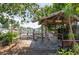 Waterfront property with a rustic wooden bar, offering a serene view of the canal and boat docks at 300 Westwinds Dr, Palm Harbor, FL 34683