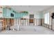 Partially renovated kitchen area with natural light and vintage cabinets at 300 Westwinds Dr, Palm Harbor, FL 34683