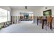 Partially renovated open-plan living area with backyard views and stone accents at 300 Westwinds Dr, Palm Harbor, FL 34683